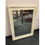 A cream bevel mirror,