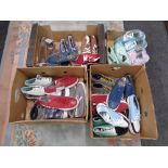 Four boxes containing a quantity of Zipz interchangeable shoes