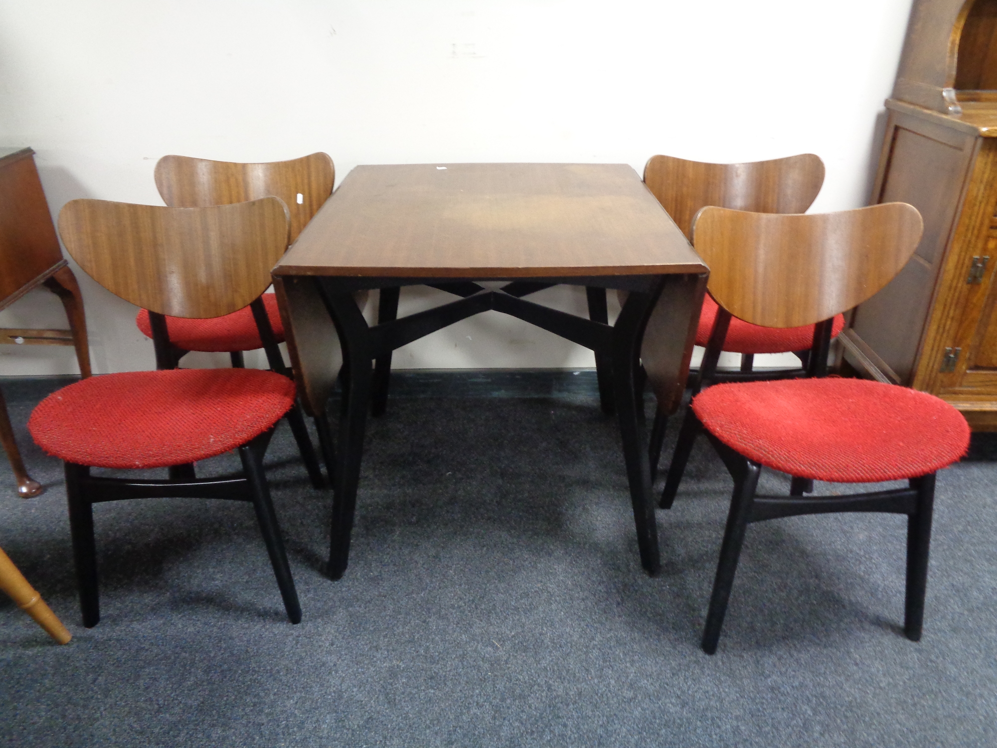 A six piece mid 20th century G-Plan teak dining room suite comprising of room divider,