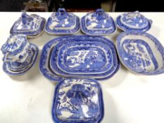 Fourteen pieces of 19th century blue and white willow pattern dinner ware to include graduated meat