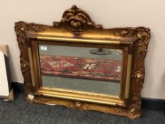 An antique gilt framed mirror,