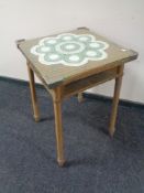 A 20th century Lloyd Loom occasional table in gold