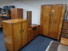 A three piece 20th century Art Deco bedroom suite comprising of double door wardrobe,