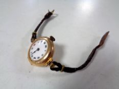 A lady's 9ct gold wristwatch on leather strap