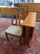 A pair of Nathan Teak dining chairs and a teak drop leaf table