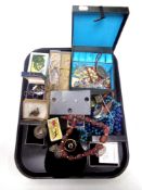 A tray containing costume jewellery,