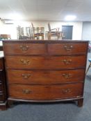 A Georgian mahogany bowfront five drawer chest with brass drop handles