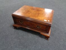 A burr elm veneered single drawer low table with brass bow handles