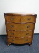 A 20th century figured walnut four drawer chest