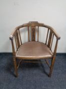 An early 20th century beech tub chair