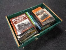 A crate of hard back and paper back books relating to railways