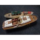 Two hand built remote controlled boats to include a pleasure craft