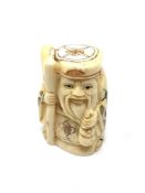 A carved Chinese bone netsuke - Village elder with staff