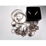 A collection of silver jewellery : brooches, rings, bangles, earrings,