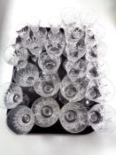 A tray containing assorted cut glass lead crystal wine and liqueur glasses