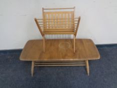 An Ercol elm and beech rectangular coffee table with undershelf together with a folding magazine