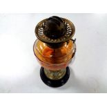 An antique brass Art Nouveau oil lamp on ceramic base with glass reservoir CONDITION