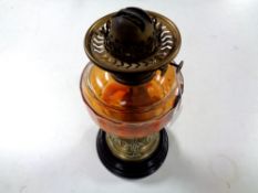 An antique brass Art Nouveau oil lamp on ceramic base with glass reservoir CONDITION