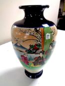 A 20th century Japanese vase depicting geishas