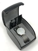 A gent's stainless steel Christin Lars quartz calendar wristwatch, boxed.