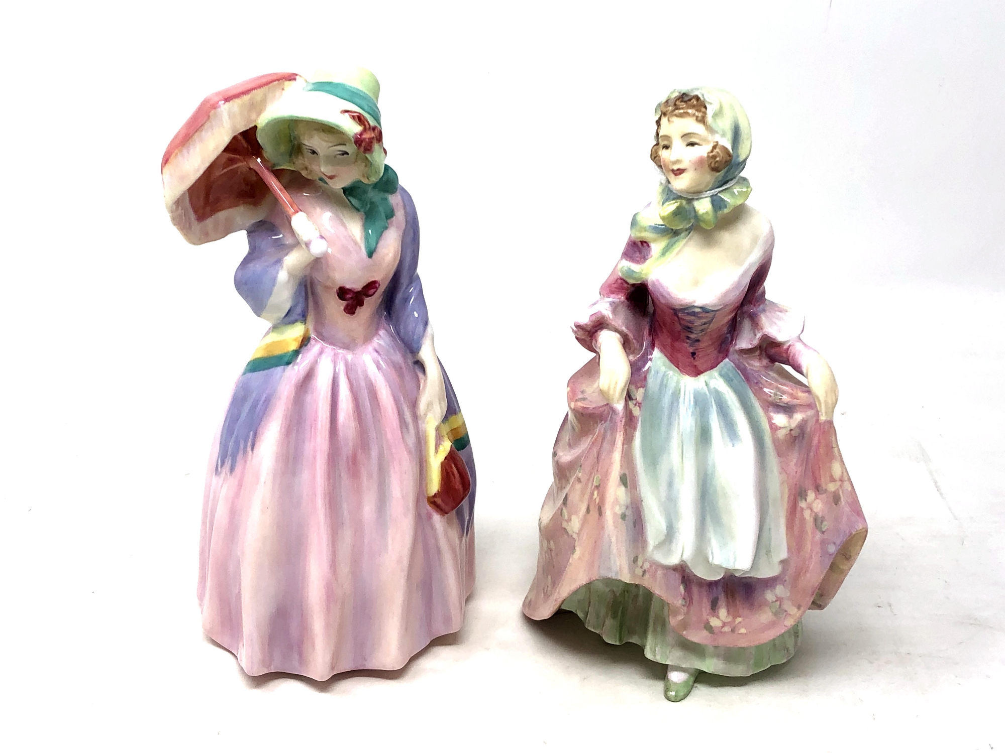 Two Royal Doulton figurines Miss Demure HN1402 and Suzette HN2026.