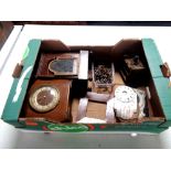 A box containing clock cases and parts,