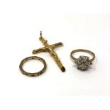A 9ct gold crucifix pendant, together with two 9ct gold rings.