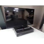 A Samsung 32'' LCD TV with remote together with a Toshiba DVD/ Video cassette recorder with remote