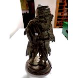 A cast iron door stop, bearded man with pitchfork,