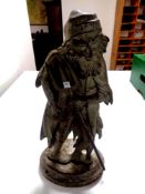 A cast iron door stop, bearded man with pitchfork,