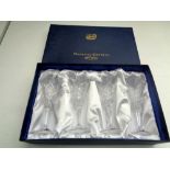 A boxed set of four Bohemia crystal wine glasses