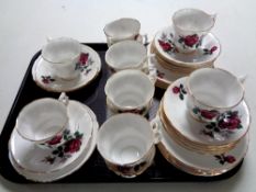 A tray containing 12 English bone china rose patterned trios