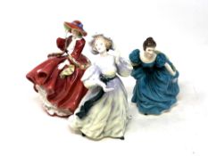 Thre Royal Doulton figurines Top o' the Hill HN1834, Rhapsody HN2267 and Grand Manner HN2723.