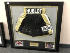 A sporting memorabilia montage : A signed pair of boxing shorts, Floyd Mayweather Jr.