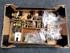 A box containing antique door and cabinet furniture to include wooden and brass handles, door locks,