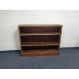 A set of early 20th century oak open bookshelves