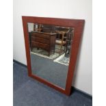 A contemporary leather framed mirror