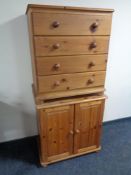 A pine four drawer chest together with pine double door cupboard