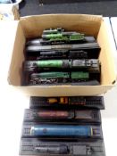 A box containing 15 die cast model trains on stands to include Flying Scotsman, A4 Mallard,