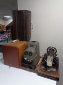 A cased vintage Vesta sewing machine (electrified) together with a cased Vivid stereo projector