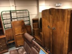 A four piece 1930's walnut bedroom suite comprising of double door wardrobe, dressing table,