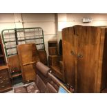 A four piece 1930's walnut bedroom suite comprising of double door wardrobe, dressing table,