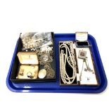 A tray of costume jewellery, pearls, silver plated vesta case,