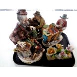 A tray containing three Capodimonte figures, Tinker, Organ Grinder and Fruit Seller,