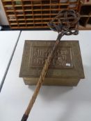 A brass embossed slipper box together with a carpet beater