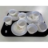 A tray containing 13 pieces of Susie Cooper bone tea china