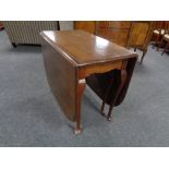 An Edwardian gate leg table