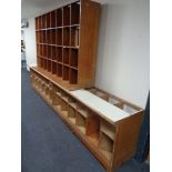 A set of 20th century plywood 32 hole haberdashers shelves together with two haberdashery counters