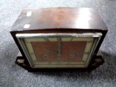 A 1930s oak cased continental mantel clock.