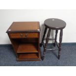 A set of narrow open shelves fitted a drawer in a mahogany finish together with a bar stool